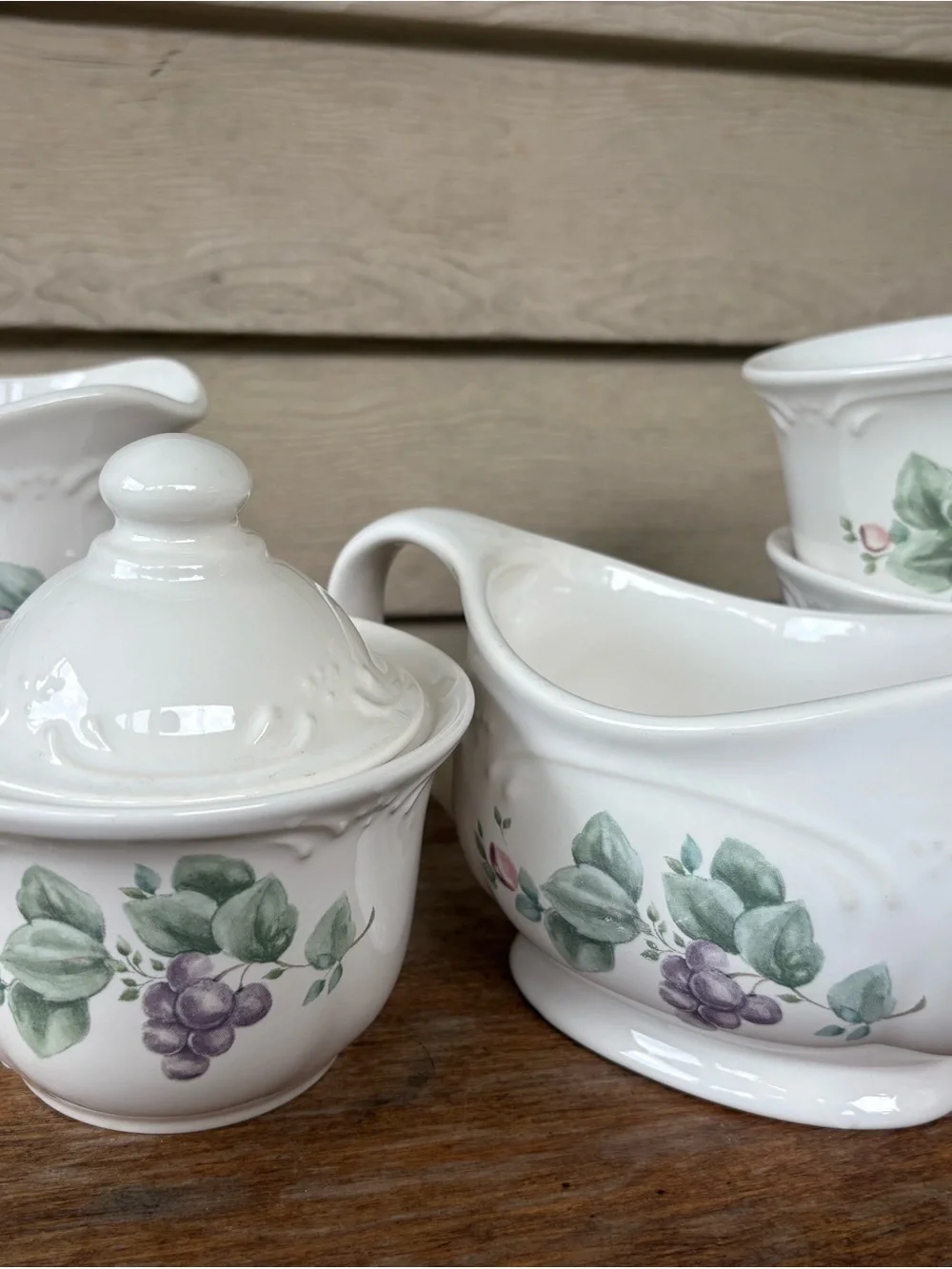 Set of Pfaltzgraff Grapevine stoneware: creamer, sugar bowl, gravy boat, 2 cups